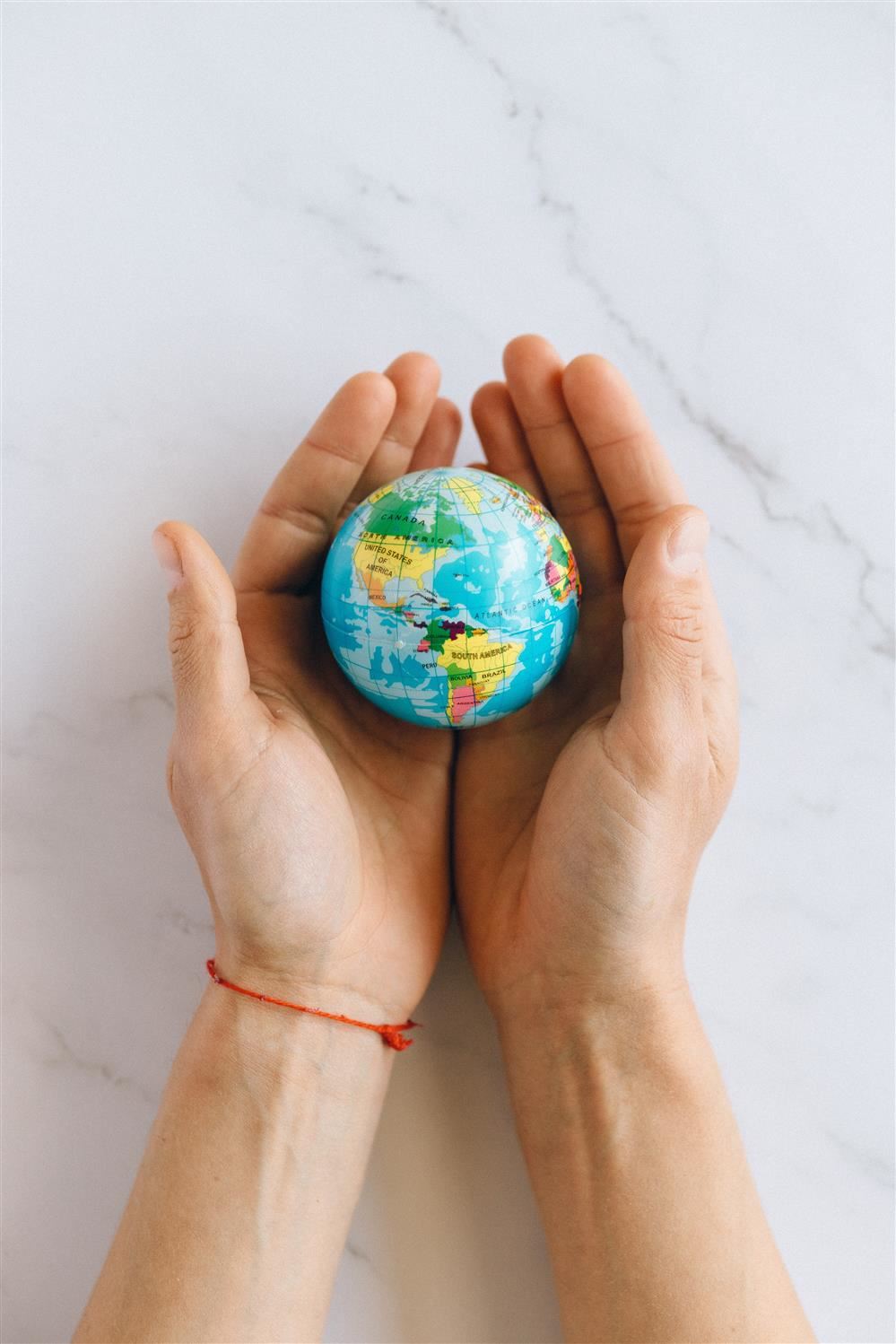 globe in hands