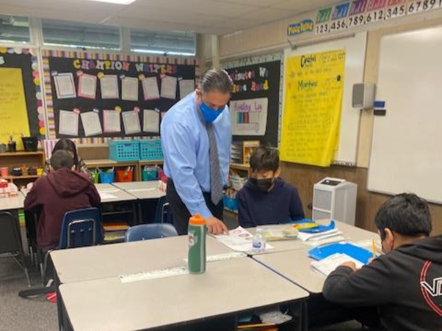 Superintendent Dr. James Q. Hammond teaching a class of OMSD students for the day
