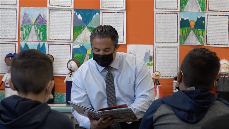 Superintendent reading to a classroom of students for \