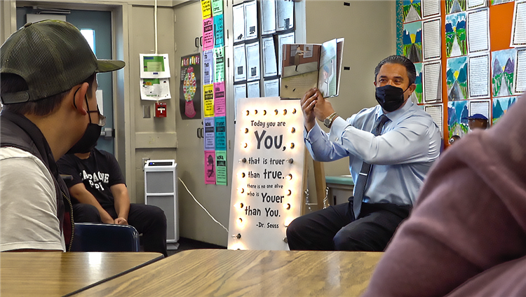 Superintendent reading to a classroom of students for \